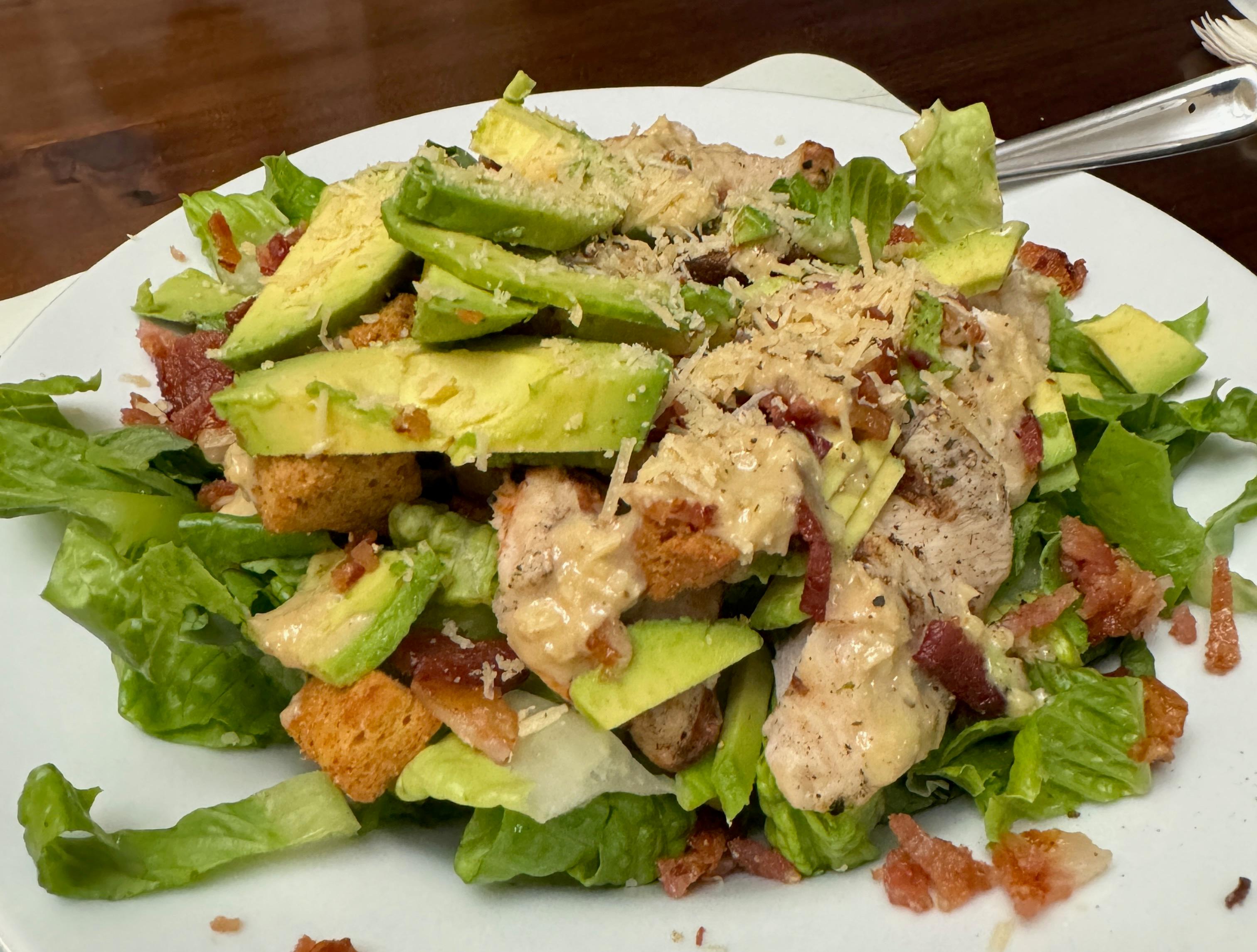 chicken caesar salad with homemade caesar dressing and homemade baked sourdough croutons